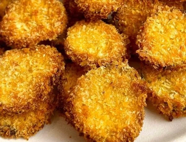 Crispy air fryer fried pickles on a plate ready to enjoy