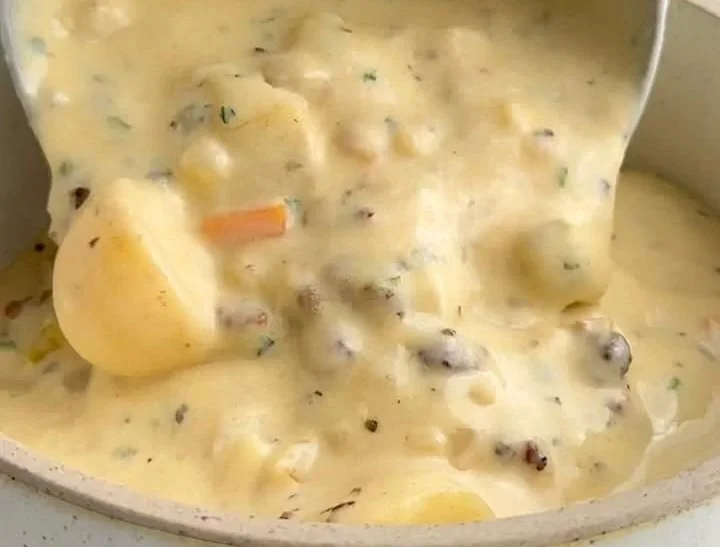 Bowl of hearty Sausage Potato Soup with herbs and spices